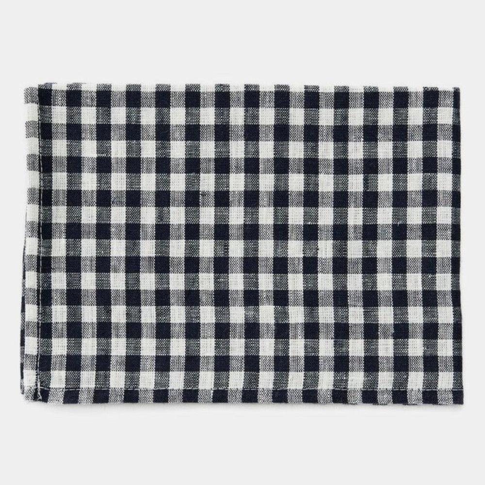 Black and white checkered kitchen towel folded on a white background