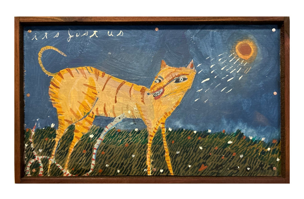 A square wooden framed folk art painting featuring an orange tabby cat standing in a grassy field at night, looking up at a bright sun in a dark blue sky.