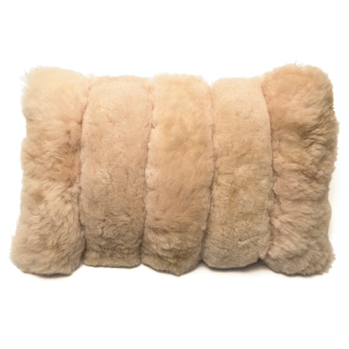 A beige alpaca wool lumbar pillow with a zipper closure.