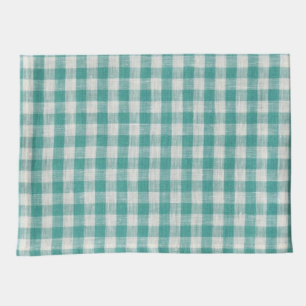 Teal and white checkered folded towel on a white background