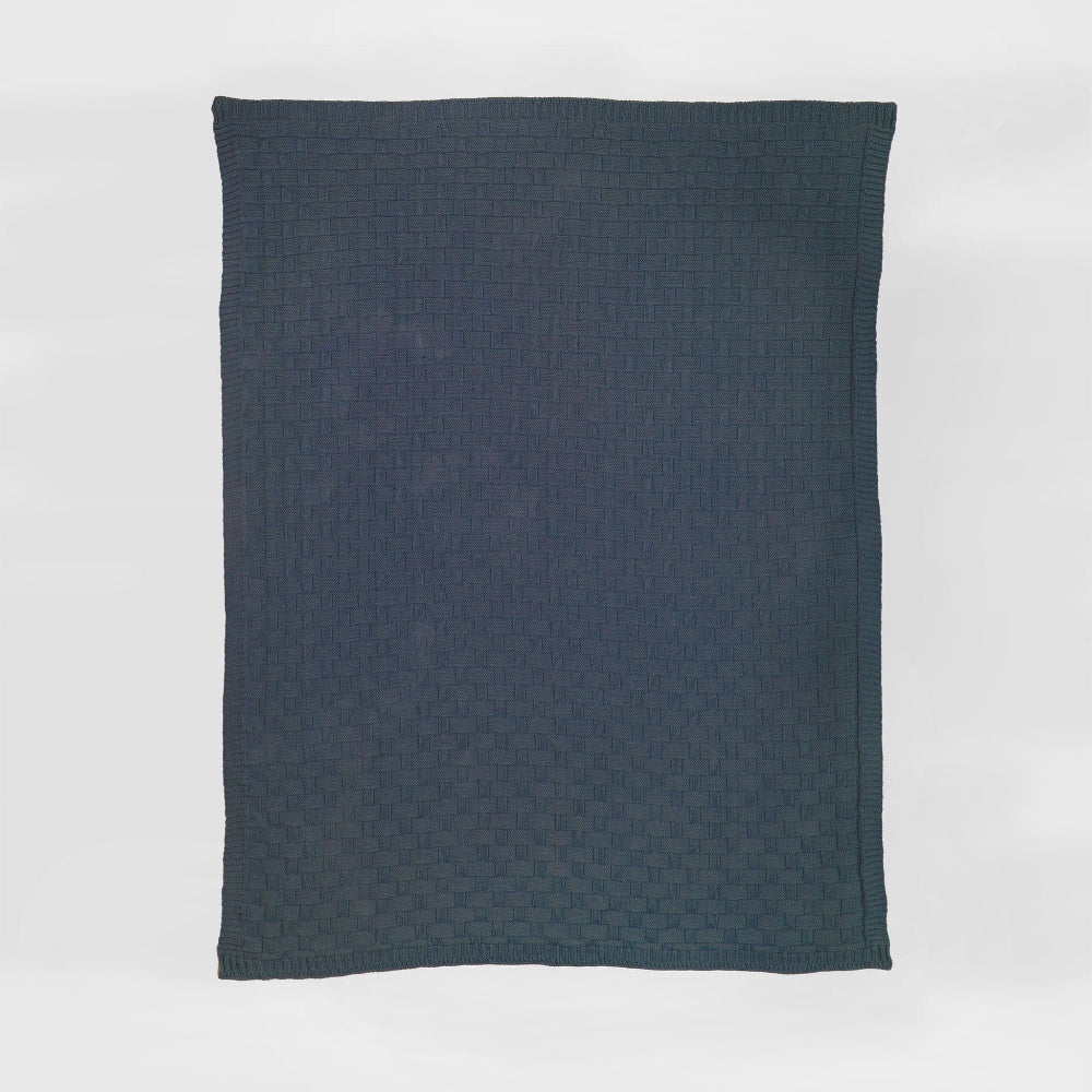 Dark blue textured blanket on a white background