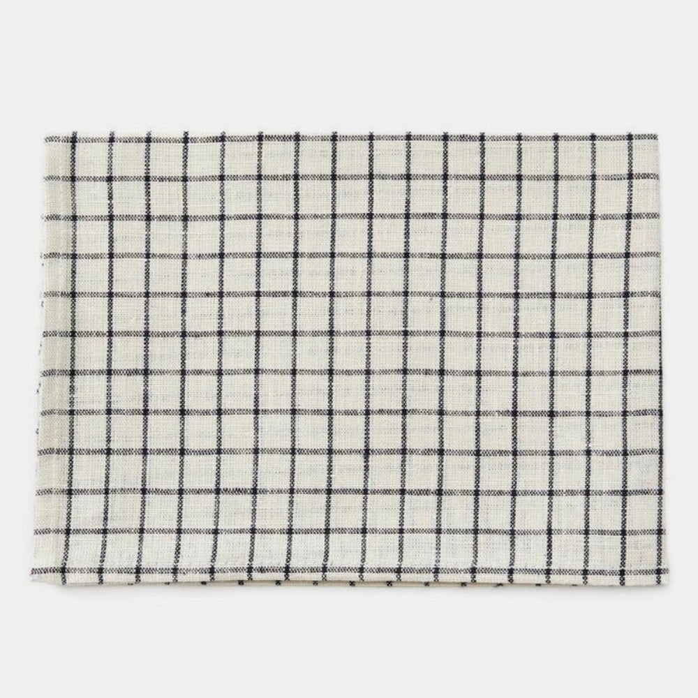 Plaid patterned kitchen towel folded on a white background