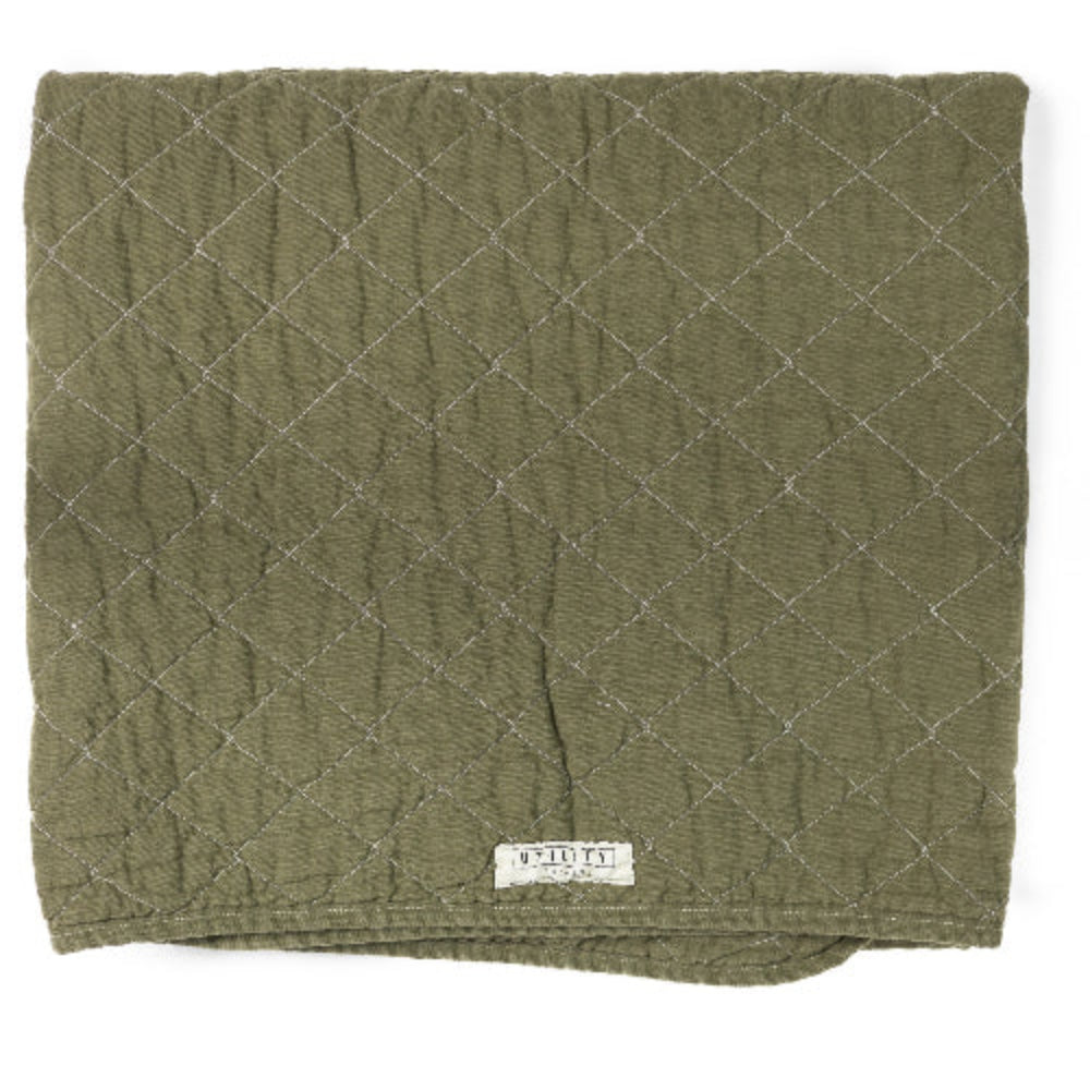 Quilted green blanket with a diamond pattern on a white background