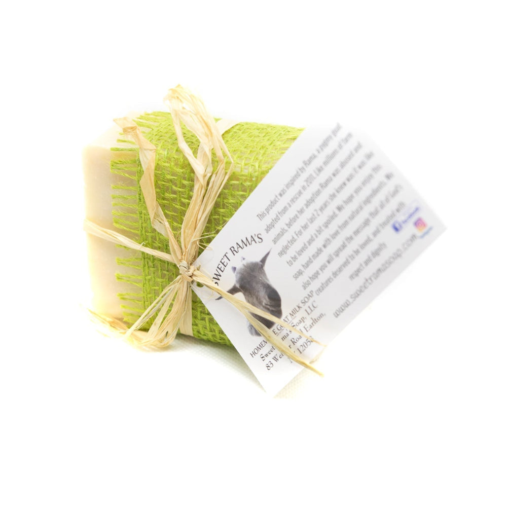 Green soap bar with a yellow rope and a card on a white background