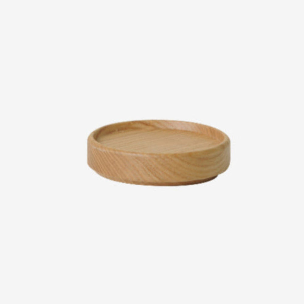 Wooden tumbler top or coaster on a white background