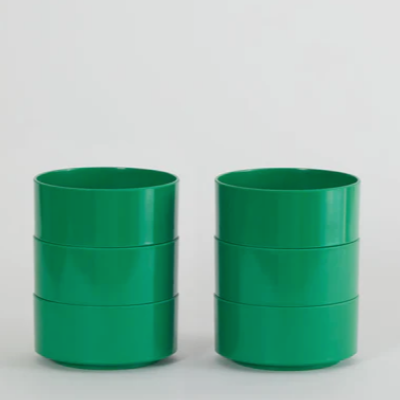 Three green Hellerware Max bowls stacked on a white background