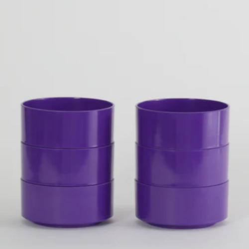 Three purple Hellerware Max Bowls stacked on each other, against a white background.