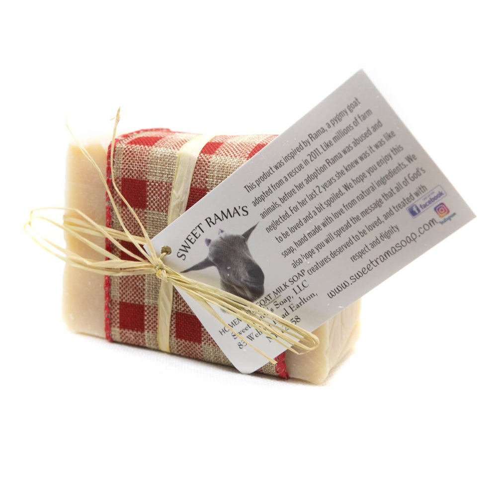 Bar of soap wrapped in plaid paper with a label on a white background